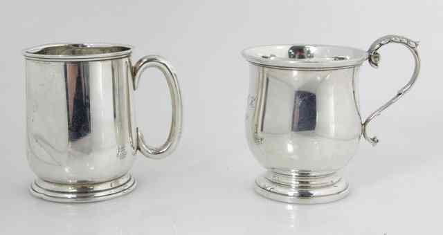 Appraisal: A silver christening mug with scroll handle Birmingham initialled APCK