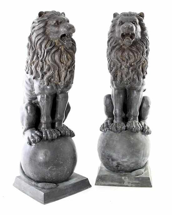 Appraisal: Pair bronze garden lions full-bodied lions sitting on orb above