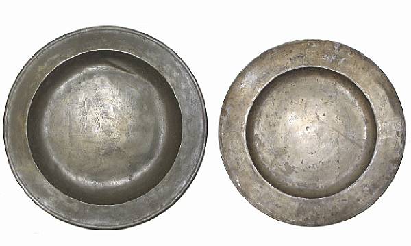 Appraisal: A group of two large pewter chargers diameter of largest