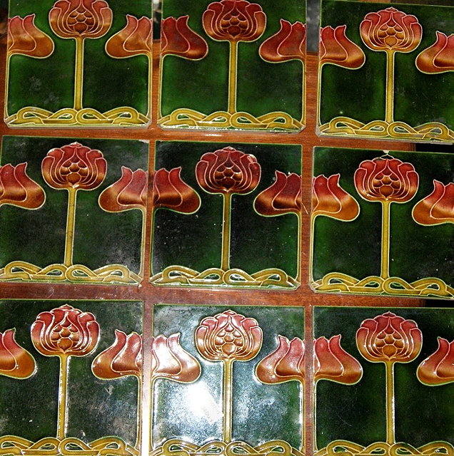 Appraisal: Set of nine Art Nouveau green glazed pottery tileseach with