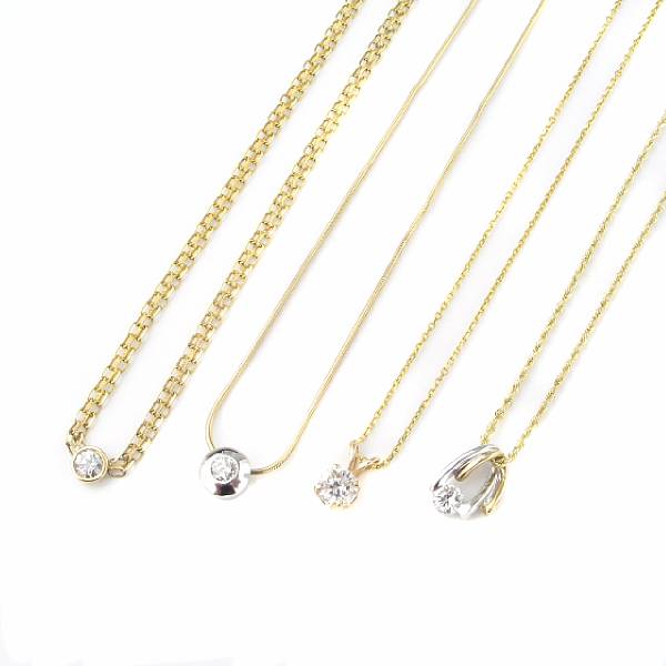 Appraisal: A collection of diamond solitaire and gold pendants with chain