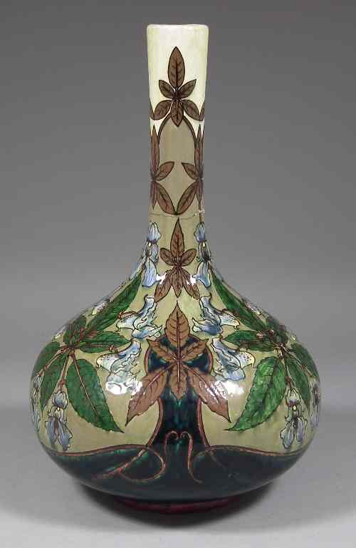 Appraisal: A Belgian pottery bottle shaped vase decorated in sgraffito and