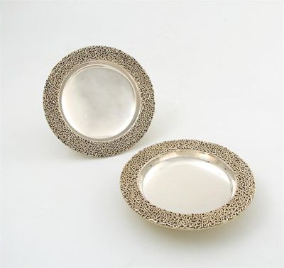 Appraisal: By Stuart Devlin a pair of parcel-gilt dishes London circular