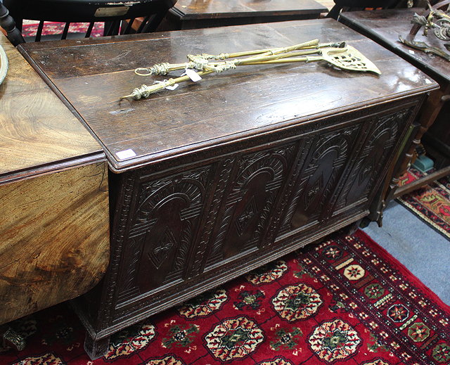 Appraisal: AN ANTIQUE OAK FOUR PANELLED COFFER with carved decoration cm