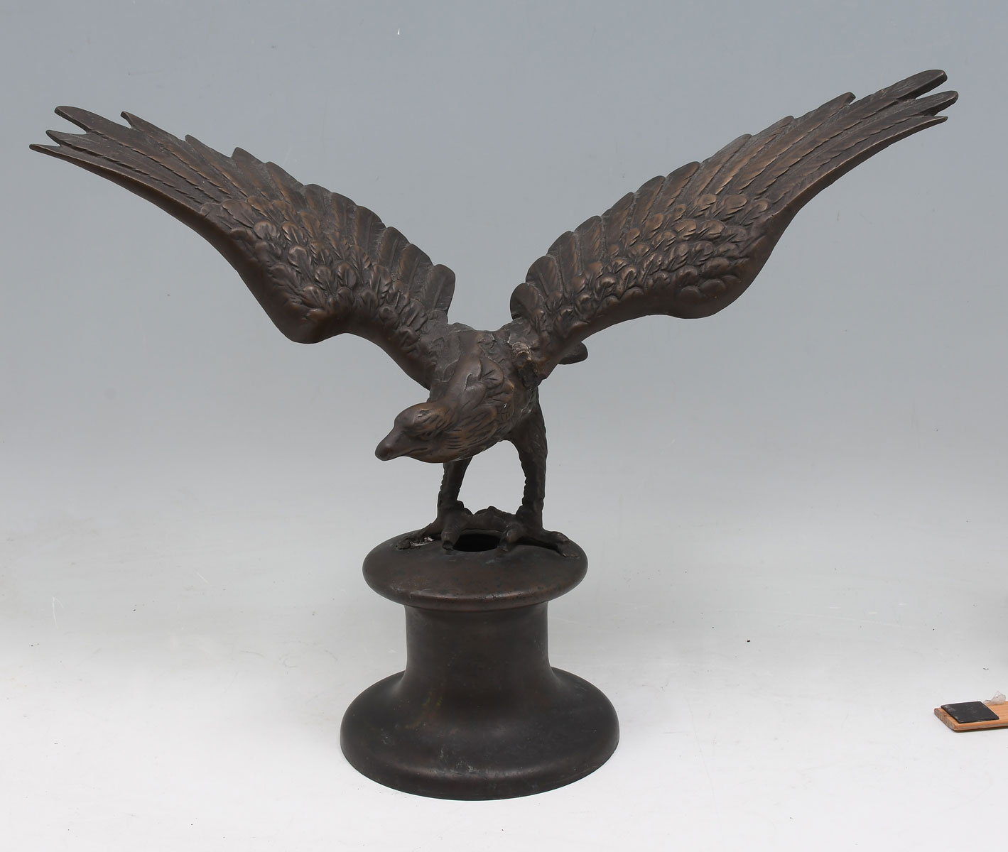 Appraisal: CAST BRONZE FLYING EAGLE Possibly a flagpole mount Approx ''