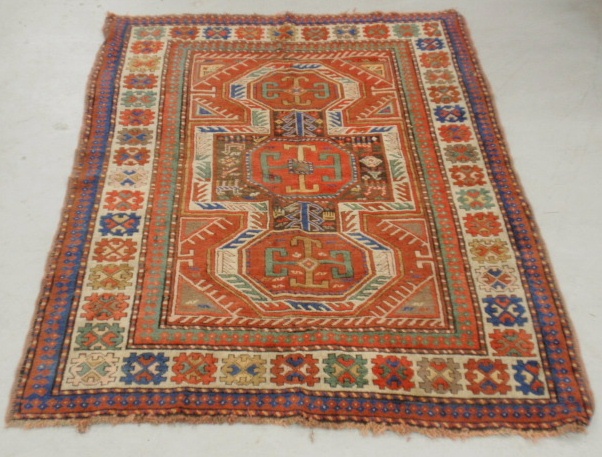 Appraisal: - Kazak oriental center hall carpet with red field and