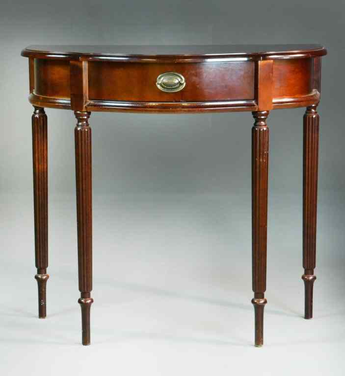 Appraisal: Mahogany Demi-Lune Hall TableHaving one drawer raised on reeed legs