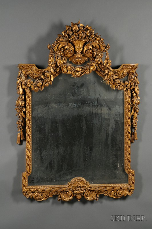 Appraisal: French Baroque-style Giltwood and Composition Mirror th century frame carved