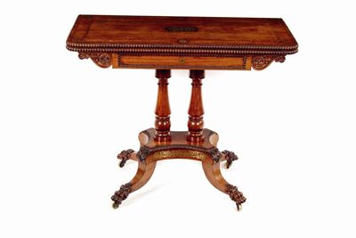 Appraisal: A Regency padouk and brass marquetry card table the hinged