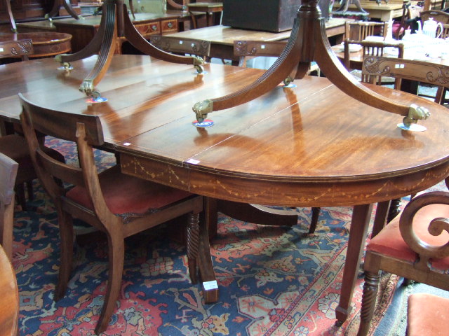 Appraisal: A mid th century mahogany and satinwood banded circular extending