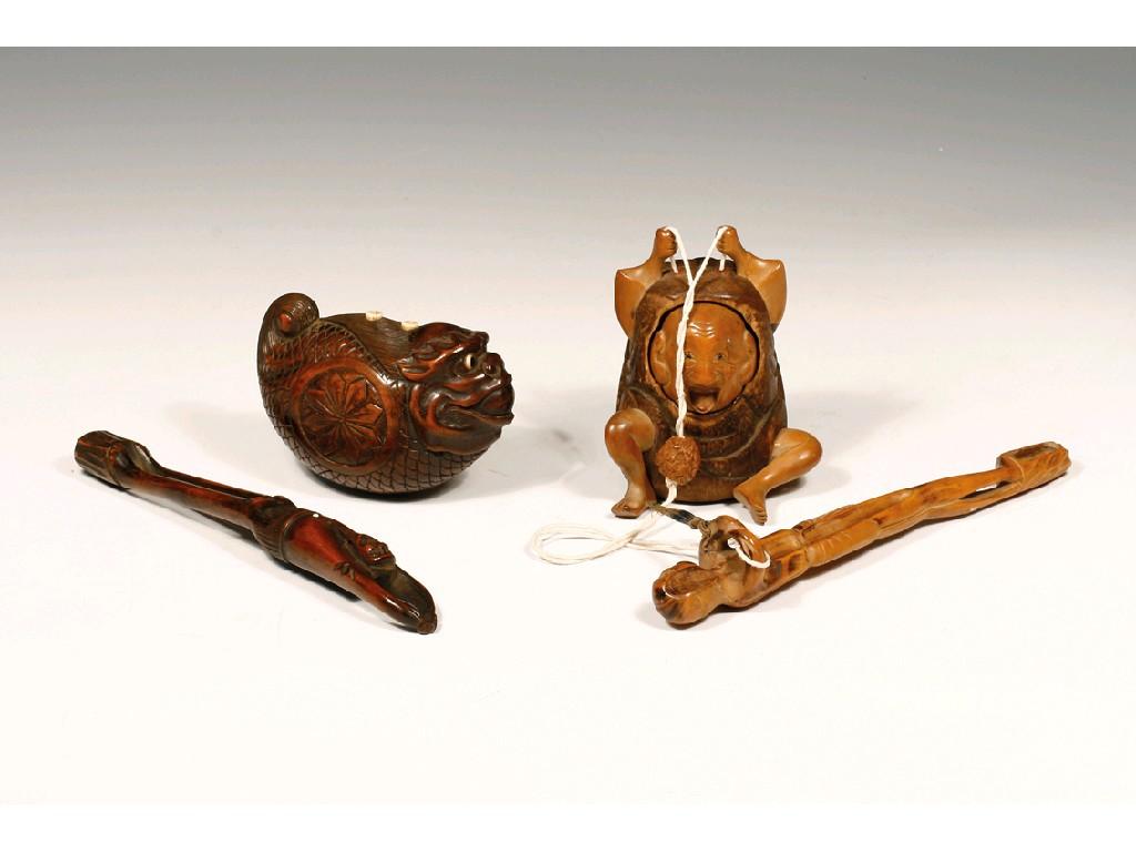 Appraisal: TWO JAPANESE CARVED WOOD PIPE SETS one with fish form