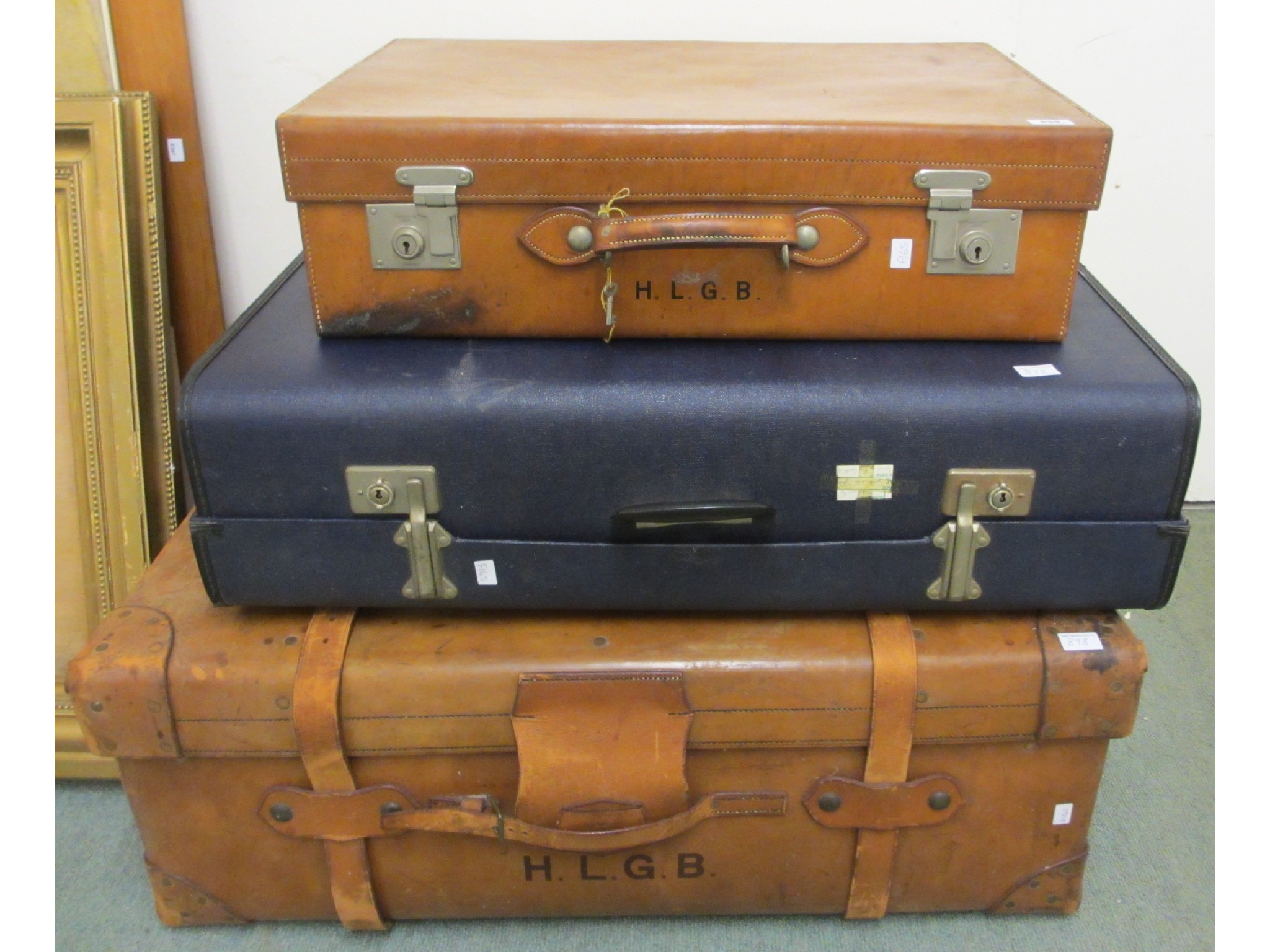 Appraisal: A vintage leather travel trunk suitcase and another