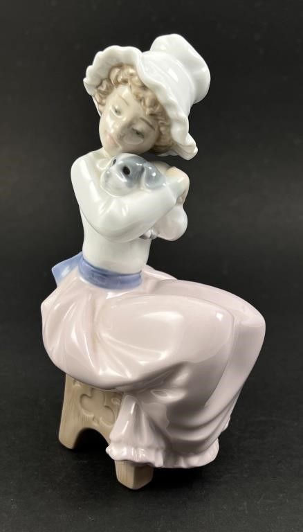 Appraisal: Nao Lladro gloss porcelain figurine of a young girl hugging