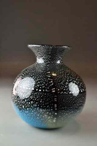 Appraisal: A Multi-Colored Speckled Art Glass VaseBulbous form with flared neck