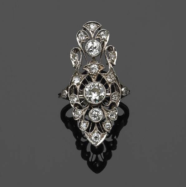 Appraisal: An art deco diamond and platinum ring estimated total diamond