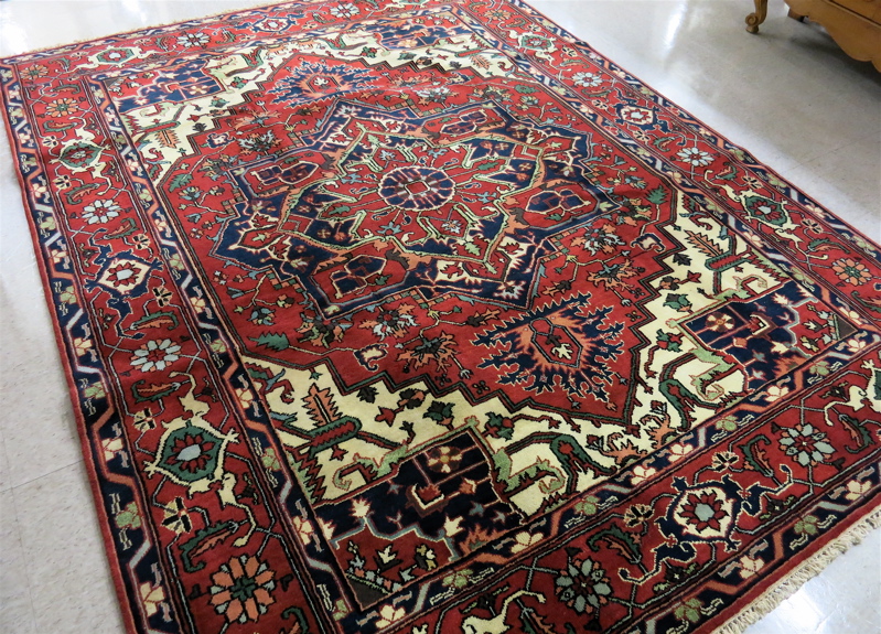 Appraisal: HAND KNOTTED ORIENTAL CARPET Persian Serapi design featuring an extra