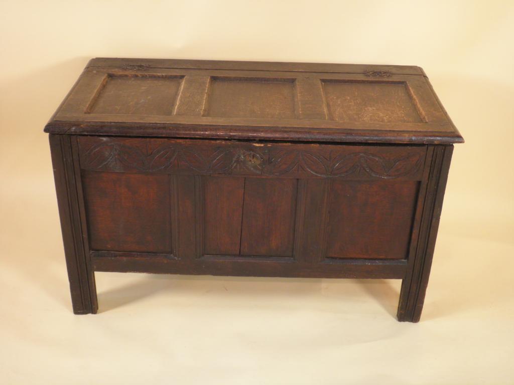 Appraisal: An early thC oak coffer with a panelled top the