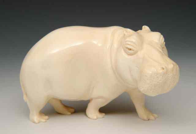 Appraisal: A CARVED INDIAN IVORY MODEL of a standing hippopotamus