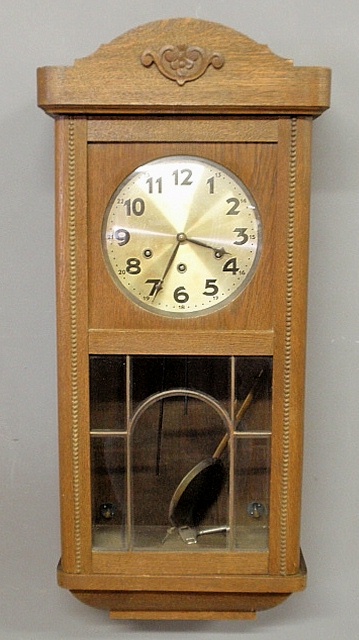 Appraisal: - Oak cased wall clock early th c with a