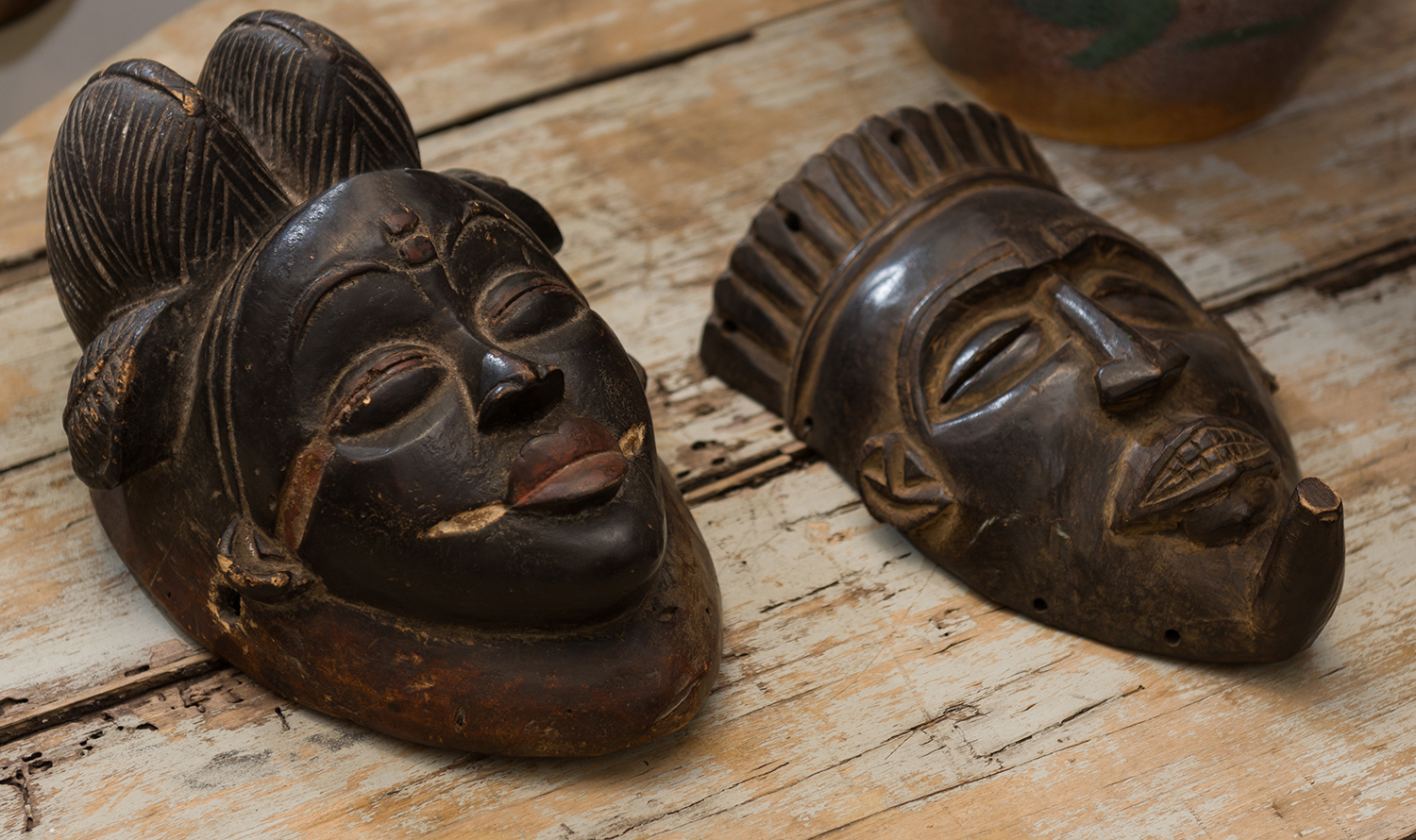 Appraisal: TWO CARVED TRIBAL MASKS AND A FERTILITY FIGURE two featured