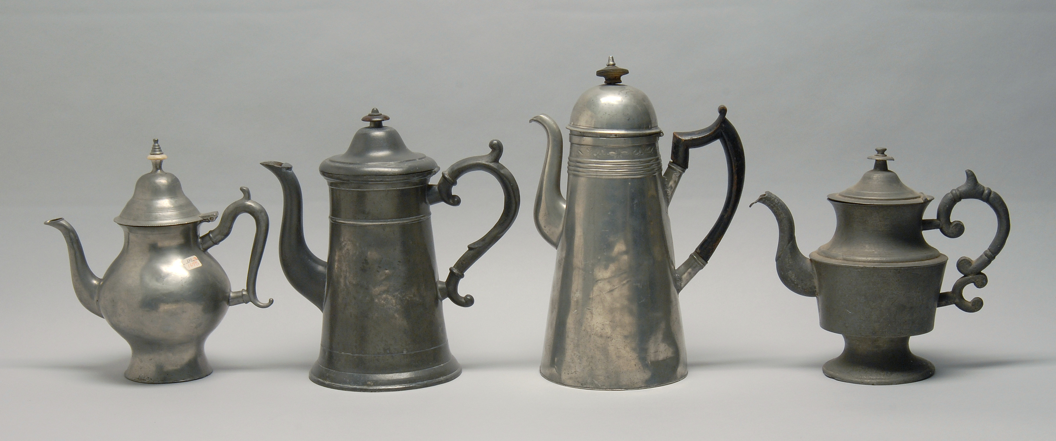 Appraisal: FOUR ANTIQUE AMERICAN PEWTER COFFEEPOTS AND TEAPOTS Early th CenturyA