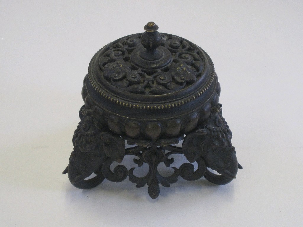 Appraisal: Bronze inkwell with pierced decoration and three elephants' heads