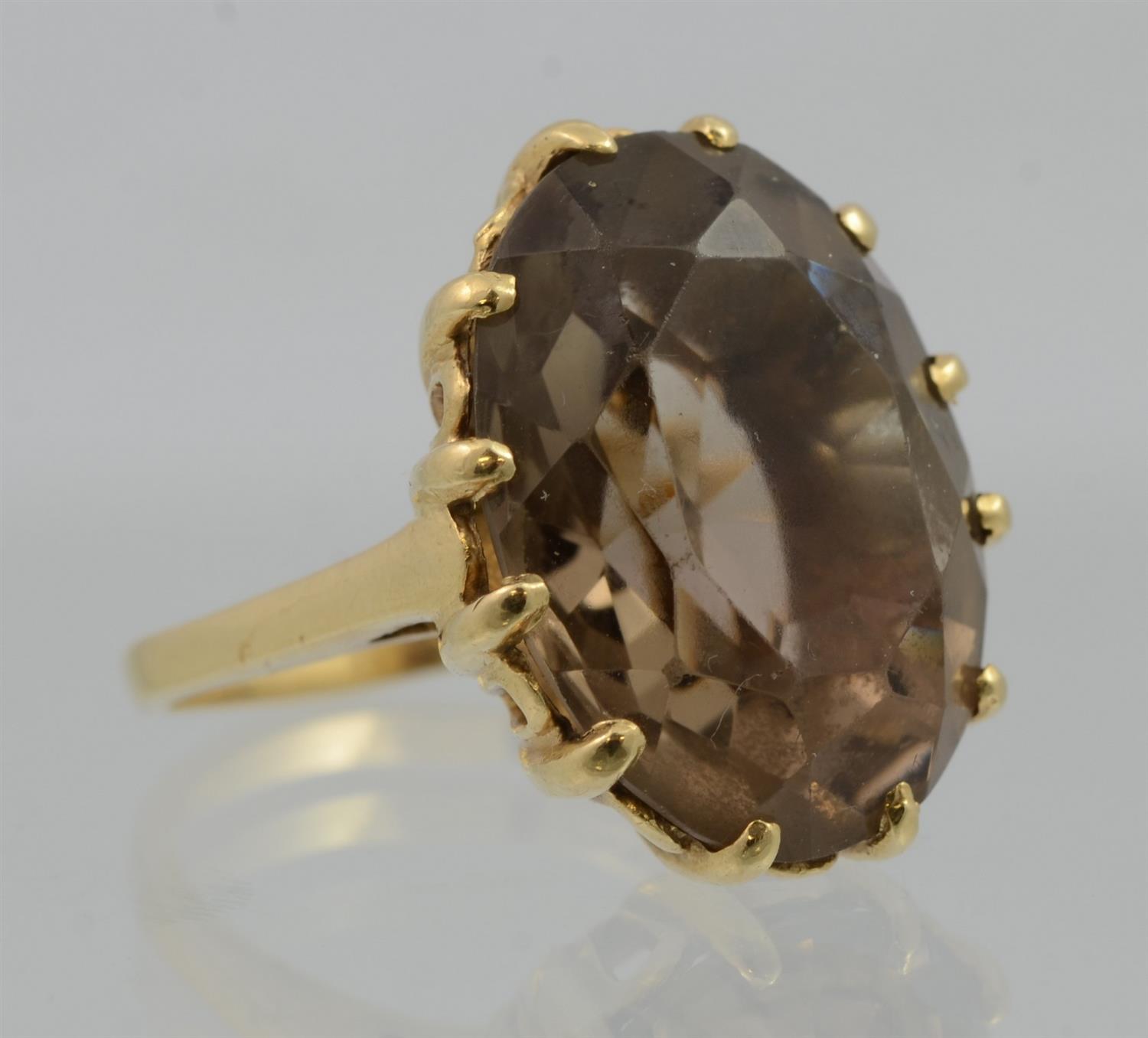 Appraisal: K Oval Faceted Smoked Topaz and Yellow Gold Ring size