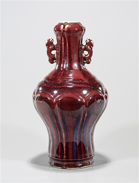 Appraisal: Chinese red glazed porcelain garlic mouth vase with handles x