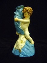 Appraisal: A Royal Worcester figural porcelain candlestick date mark for modelled