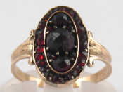 Appraisal: A yellow metal Bohemian garnet ring approx mm wide ring