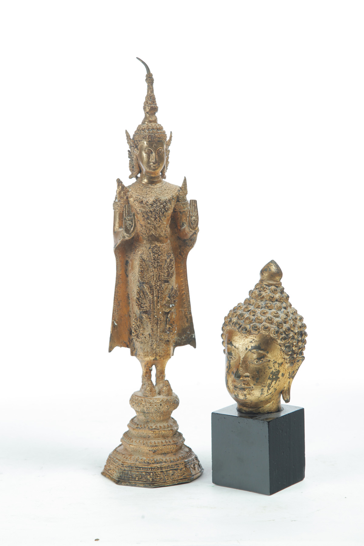 Appraisal: TWO ASIAN BRONZE BUDDHAS Twentieth century Gilt surfaces Standing h