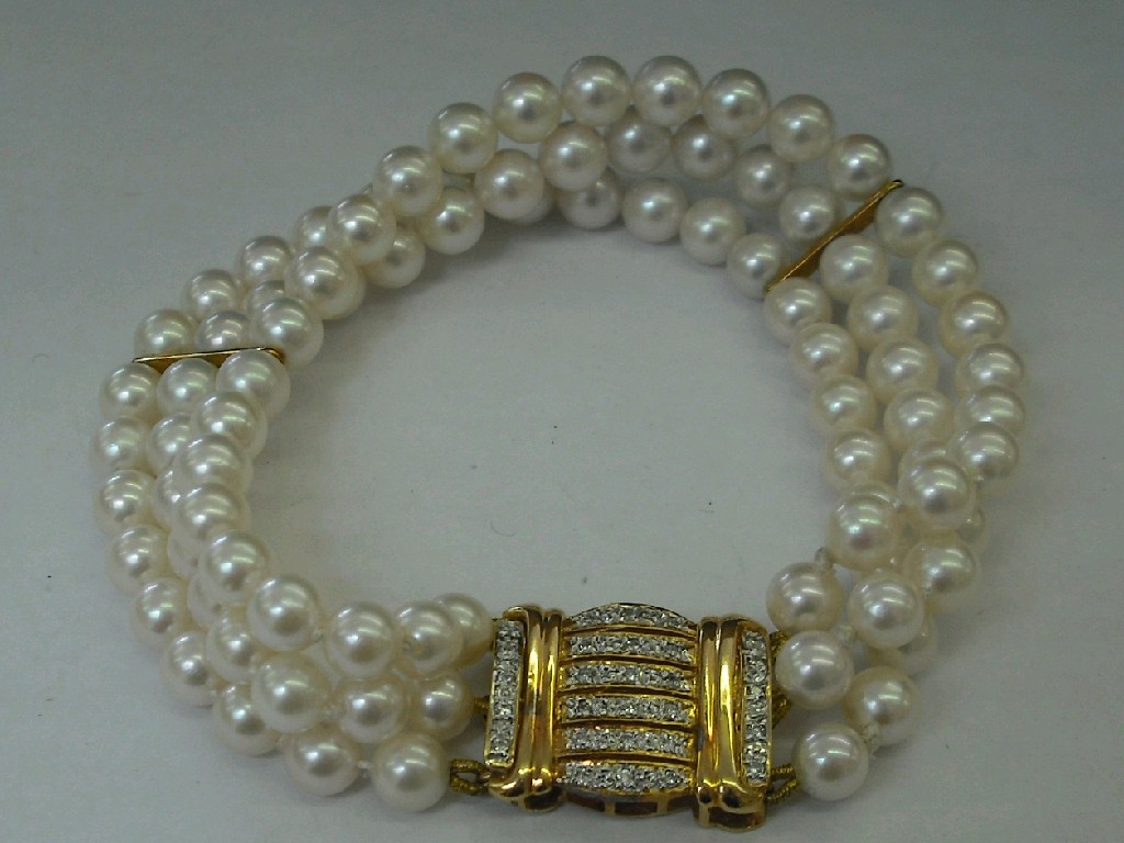 Appraisal: Cultured pearl uniform three row bracelet with an ct diamond