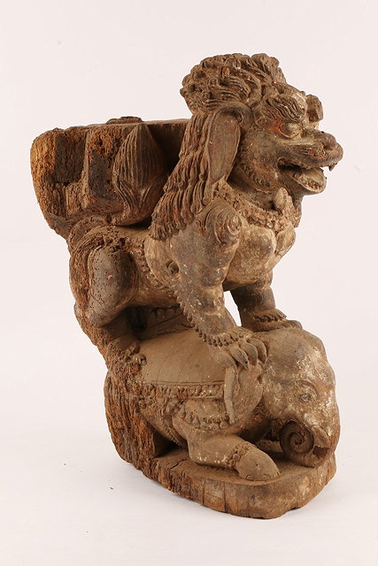 Appraisal: AN ANTIQUE INDIAN CARVED WOODEN TEMPLE FIGURE in the form