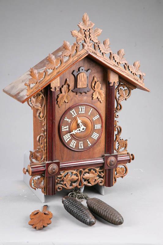 Appraisal: CUCKOO CLOCK Oak clock with pierced carved leaf and vine