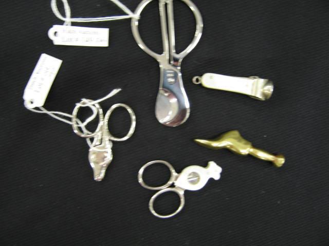 Appraisal: Collection of Cigar Cutters plus a figural brass pipe tamper