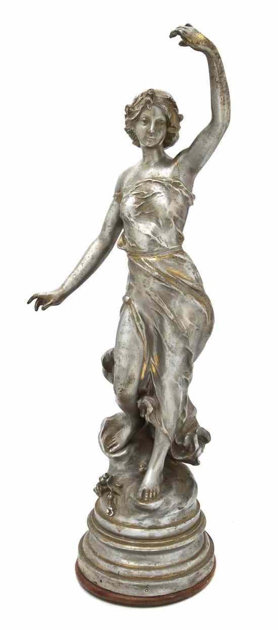 Appraisal: A Continental Silvered Metal Figure depicting a robed maiden raised