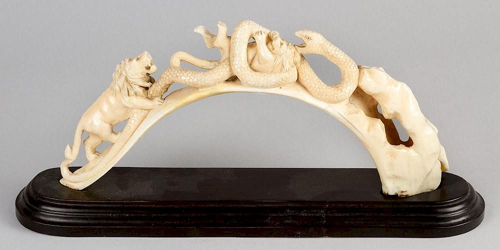 Appraisal: An ivory bangle An ivory bangle with carved fight of