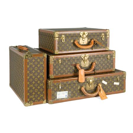 Appraisal: Group of Four Louis Vuitton Monogram Toile Suitcases Estimate -