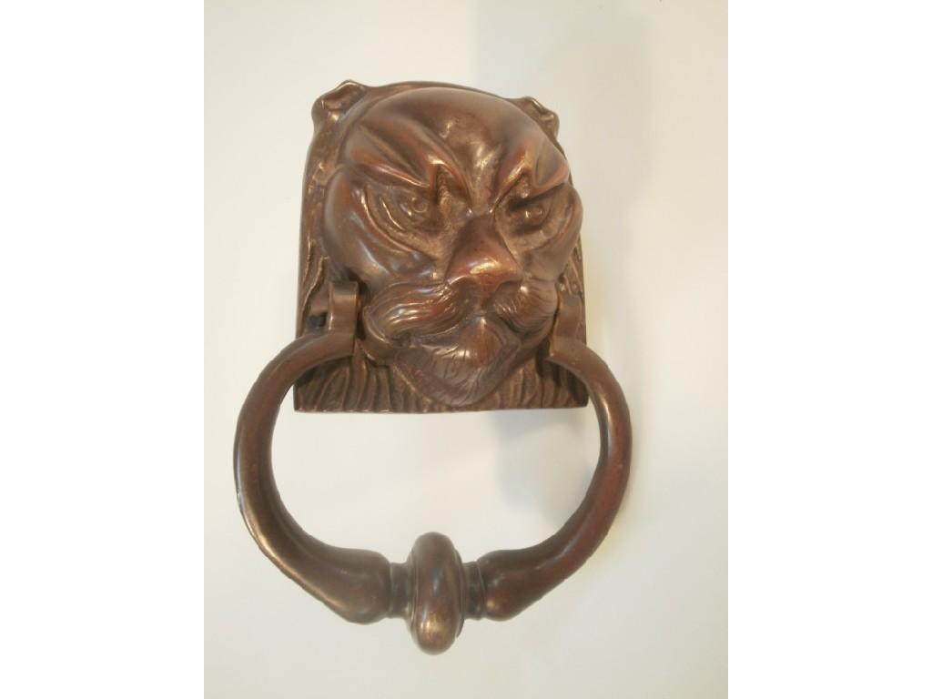 Appraisal: A Bronze door knocker in the shape of a lions