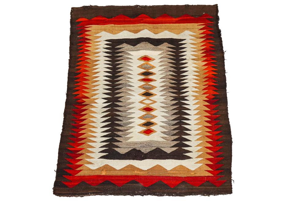 Appraisal: NAVAJO WOOL RUGwith stacked diamond motifs within serrated borders x