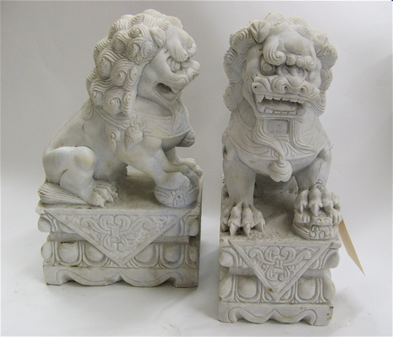 Appraisal: PAIR OF CHINESE CARVED MARBLE FOO LIONS of solid white