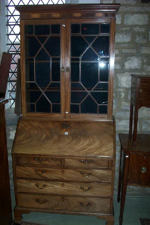 Appraisal: A Georgian mahogany bureau bookcase the bureau fitted with long