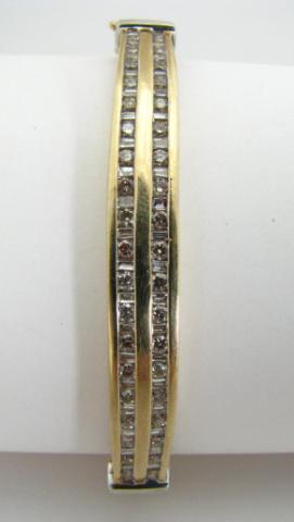 Appraisal: K Yellow Gold bracelet with alternating channel mounted baguette and