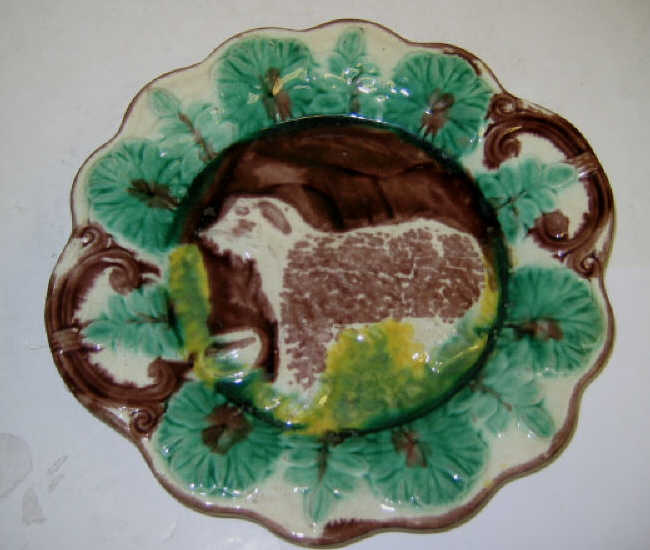 Appraisal: ANTIQUE MAJOLICA DISH WITH DOG FIGURE Probably Arsenal Potteries Trenton