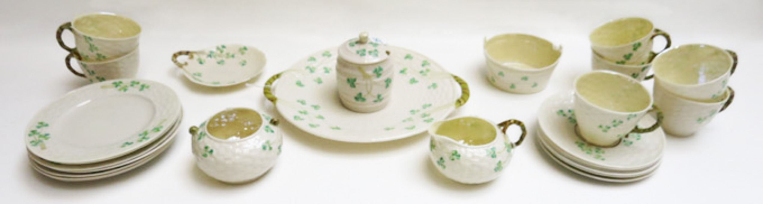 Appraisal: TWENTY-SEVEN PIECES BELLEEK SHAMROCK TABLE WARE consisting of cookie plate