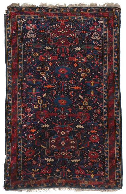 Appraisal: Caucasian rug c stylized floral design in blue red and