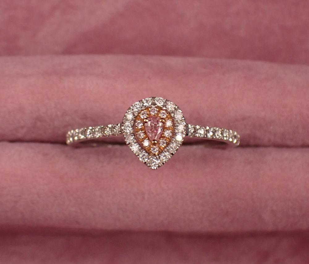 Appraisal: PINK DIAMOND AND EIGHTEEN KARAT TWO-TONE GOLD RING The k