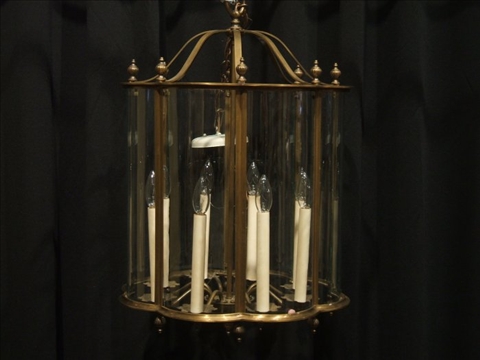 Appraisal: MODERN BRASS AND GLASS HALL LANTERN With eight candle-form lights