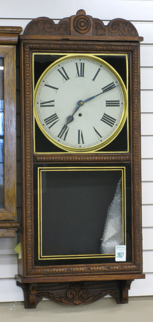 Appraisal: AN AMERICAN OAK WALL CLOCK Crane model Waterbury Clock Co