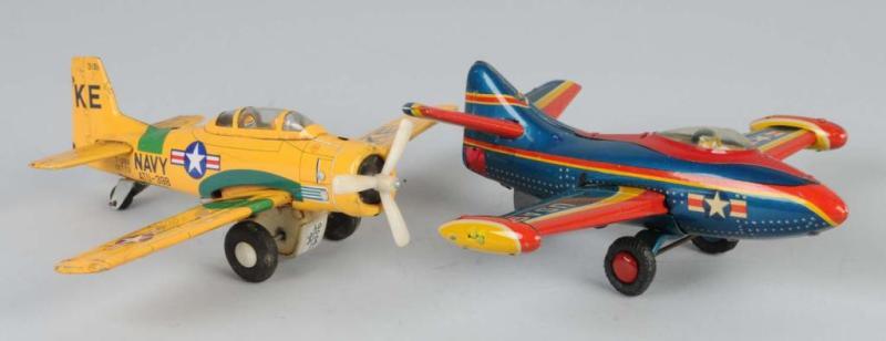 Appraisal: Lot of Tin Airplane Friction Toys Description Japanese Working Both